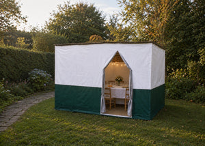 The Deluxe Sukkah set for yom tov in a garden at dusk