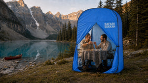 The Safari Sukkah pitched by a mountain lake at dusk